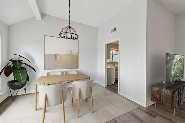 11224 Nieman Rd Unit 302, Overland Park, KS 66210 - dining space featuring light wood finished floors and a chandelier