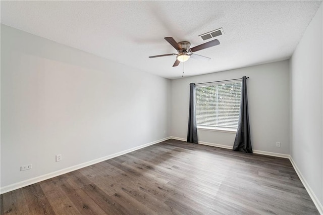11224 Nieman Rd Unit 302, Overland Park, KS 66210 - spare room with ceiling fan, wood finished floors, and a textured ceiling