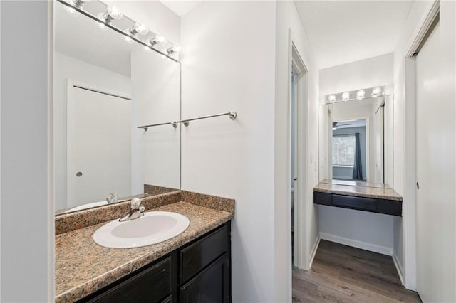 11224 Nieman Rd Unit 302, Overland Park, KS 66210 - bathroom with wood finished floors and vanity