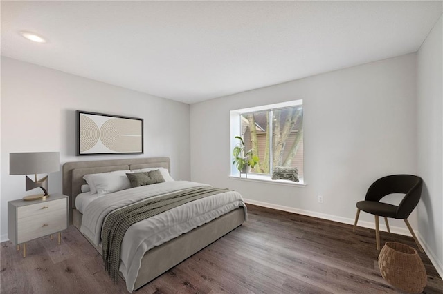 11224 Nieman Rd Unit 302, Overland Park, KS 66210 - bedroom featuring wood finished floors and baseboards