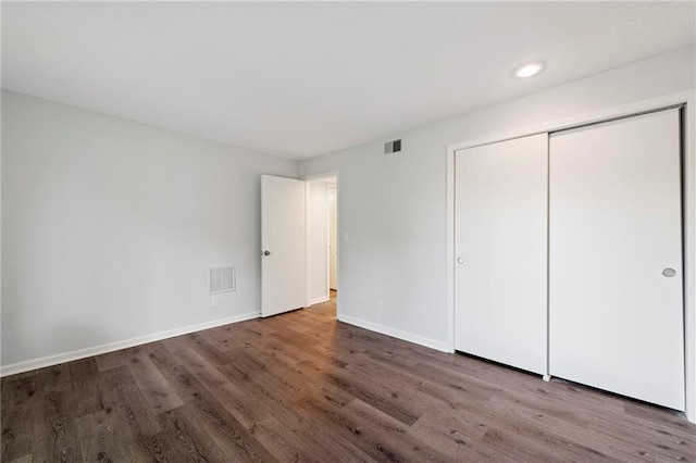 11224 Nieman Rd Unit 302, Overland Park, KS 66210 - unfurnished bedroom with wood finished floors, recessed lighting, and a closet
