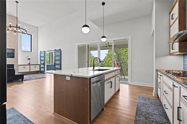 22615 W 87th Ter, Lenexa, KS 66227 - kitchen featuring stainless steel appliances, extractor fan, a chandelier, high vaulted ceiling, and plenty of natural light