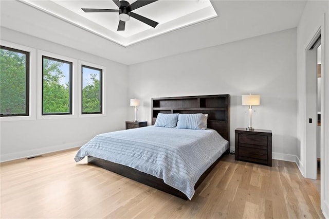 22615 W 87th Ter, Lenexa, KS 66227 - bedroom with light wood-style floors and a ceiling fan