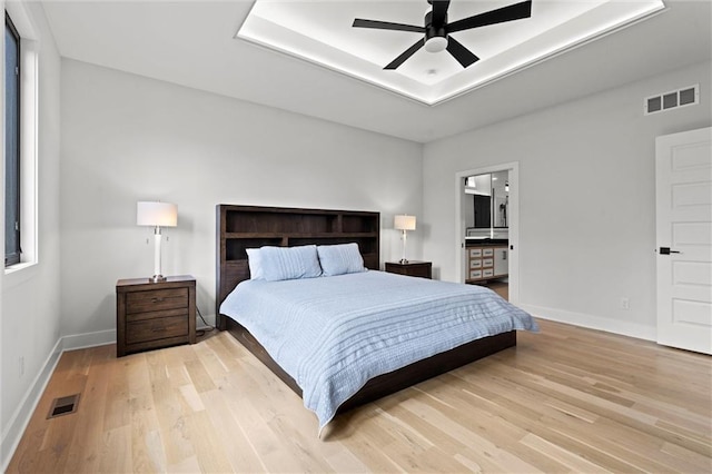 22615 W 87th Ter, Lenexa, KS 66227 - bedroom with light wood-style flooring, a ceiling fan, and ensuite bathroom