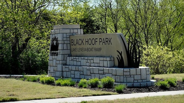 22615 W 87th Ter, Lenexa, KS 66227 - community / neighborhood sign with a forest view