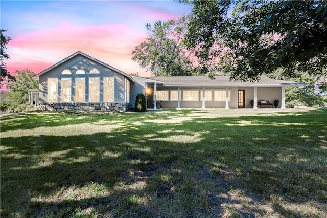 1015 S Wyckford Rd, Olathe, KS 66061 - back of house with a lawn