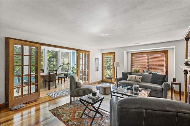 1015 S Wyckford Rd, Olathe, KS 66061 - living room with a textured ceiling and light wood-style floors