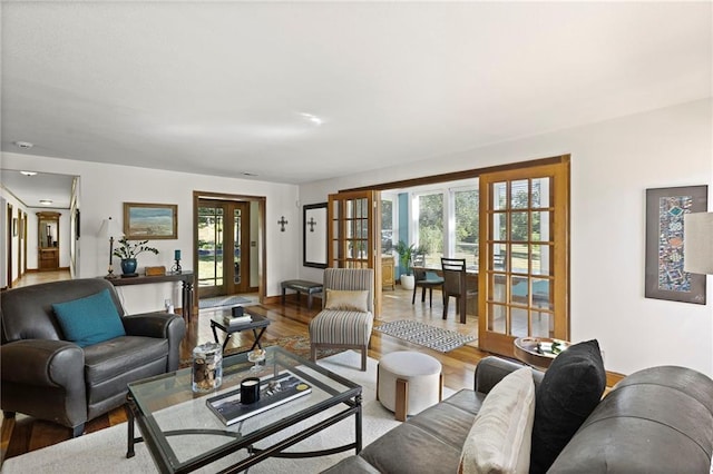 1015 S Wyckford Rd, Olathe, KS 66061 - living area featuring french doors and wood finished floors