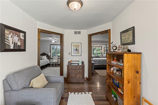 1015 S Wyckford Rd, Olathe, KS 66061 - sitting room featuring dark wood-style floors