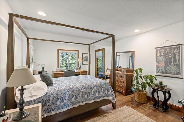 1015 S Wyckford Rd, Olathe, KS 66061 - bedroom featuring wood finished floors and recessed lighting