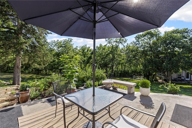 1015 S Wyckford Rd, Olathe, KS 66061 - view of patio with outdoor dining space and view of scattered trees