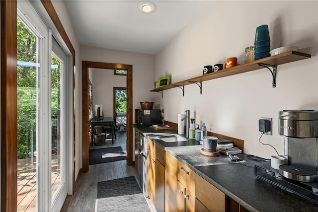 1015 S Wyckford Rd, Olathe, KS 66061 - kitchen featuring open shelves, healthy amount of natural light, and dark countertops