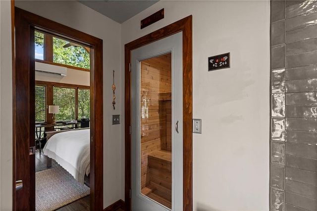 1015 S Wyckford Rd, Olathe, KS 66061 - doorway to outside featuring a wall mounted AC and baseboards