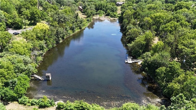 1015 S Wyckford Rd, Olathe, KS 66061 - drone / aerial view of a nearby body of water and a heavily wooded area