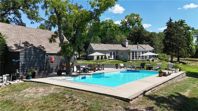 1015 S Wyckford Rd, Olathe, KS 66061 - outdoor pool with a patio and a lawn