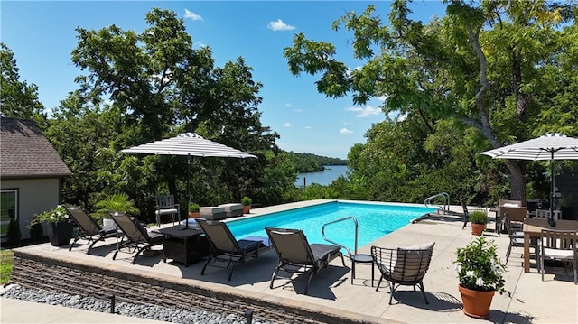 1015 S Wyckford Rd, Olathe, KS 66061 - outdoor pool with a patio area, a water view, and view of scattered trees