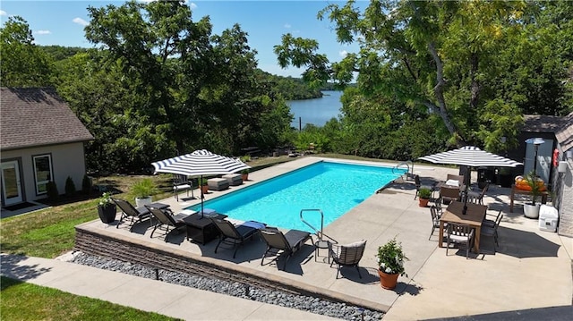 1015 S Wyckford Rd, Olathe, KS 66061 - swimming pool featuring a patio area and a water view