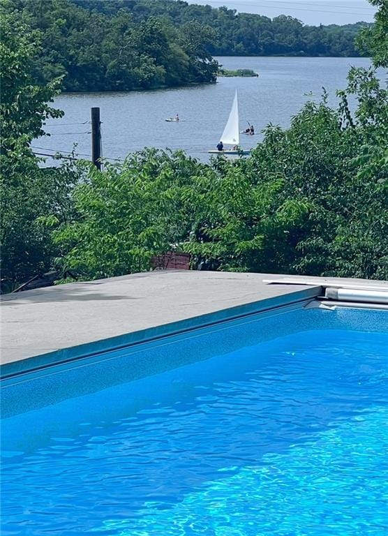 1015 S Wyckford Rd, Olathe, KS 66061 - outdoor pool featuring a water view and a forest view