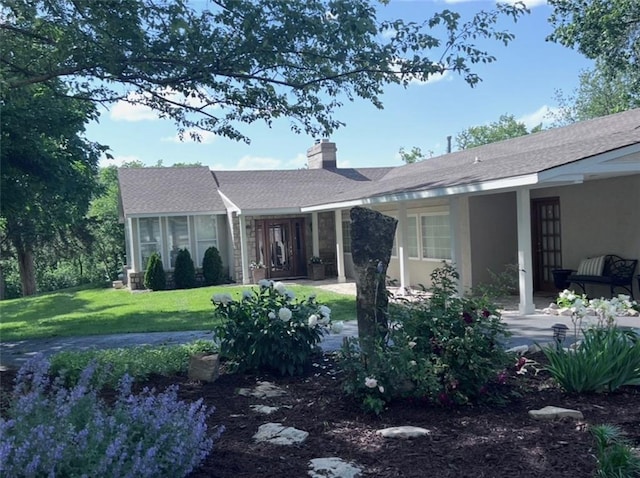 1015 S Wyckford Rd, Olathe, KS 66061 - view of front facade featuring a front lawn, a chimney, and a shingled roof