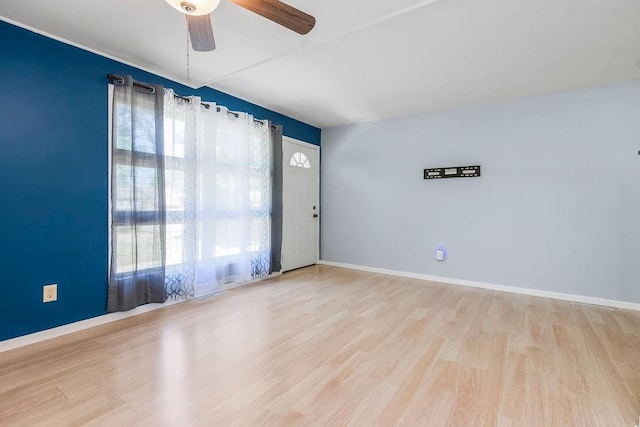 1202 S Willow St, Ottawa, KS 66067 - empty room with a ceiling fan and wood finished floors