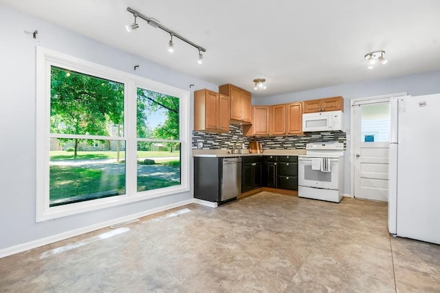 1202 S Willow St, Ottawa, KS 66067 - kitchen with white appliances, light countertops, and tasteful backsplash