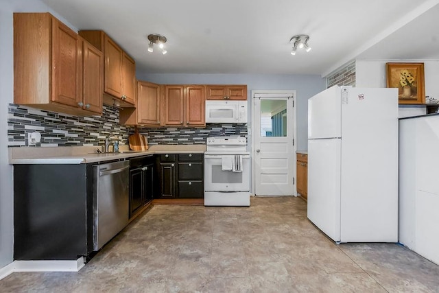 1202 S Willow St, Ottawa, KS 66067 - kitchen with white appliances, light countertops, backsplash, and brown cabinetry