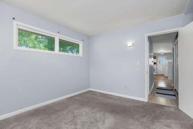 1202 S Willow St, Ottawa, KS 66067 - carpeted spare room featuring baseboards