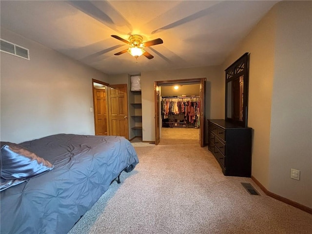 2006 Buckingham St, Saint Joseph, MO 64506 - bedroom featuring light colored carpet, a ceiling fan, and a spacious closet