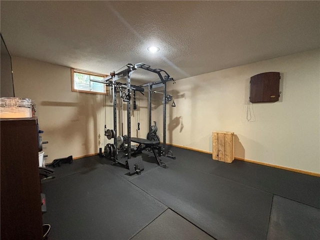 2006 Buckingham St, Saint Joseph, MO 64506 - exercise room featuring a textured ceiling and baseboards