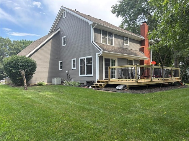 2006 Buckingham St, Saint Joseph, MO 64506 - rear view of house with a chimney, a wooden deck, a yard, and roof with shingles