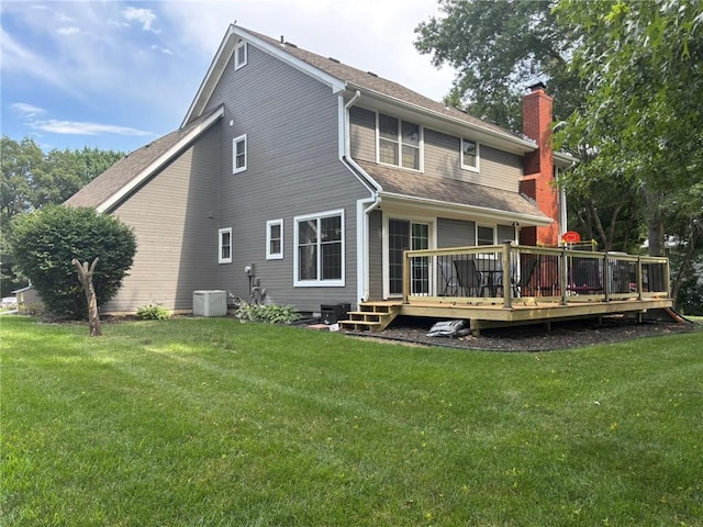 2006 Buckingham St, Saint Joseph, MO 64506 - back of house with a chimney, a deck, a yard, and roof with shingles