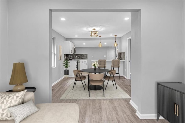 804 S Cedar Ave, Independence, MO 64053 - dining area with light wood finished floors and recessed lighting