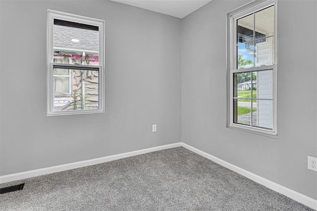 804 S Cedar Ave, Independence, MO 64053 - spare room with carpet flooring and baseboards