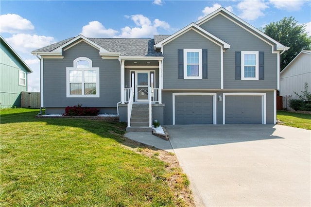 2105 NW Sweetgum Ct, Grain Valley, MO 64029 - split level home featuring driveway, a garage, a front yard, and roof with shingles
