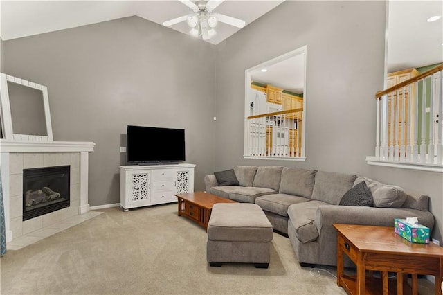 2105 NW Sweetgum Ct, Grain Valley, MO 64029 - living room featuring ceiling fan, light colored carpet, vaulted ceiling, a fireplace, and recessed lighting