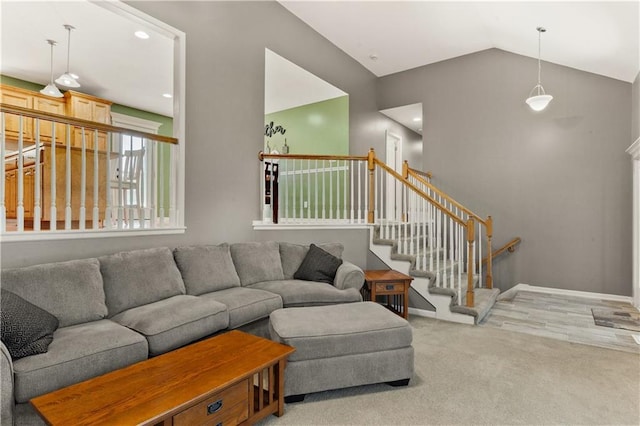 2105 NW Sweetgum Ct, Grain Valley, MO 64029 - carpeted living room featuring vaulted ceiling and stairs