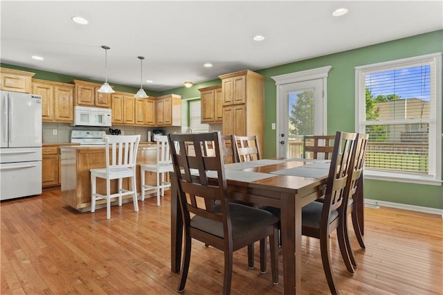 2105 NW Sweetgum Ct, Grain Valley, MO 64029 - dining room with light wood finished floors and recessed lighting