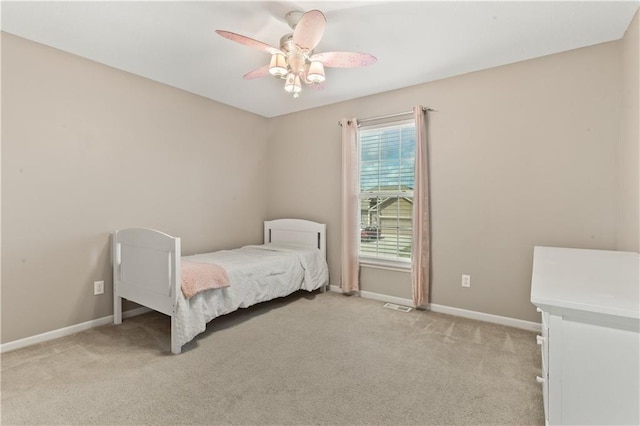 2105 NW Sweetgum Ct, Grain Valley, MO 64029 - bedroom with light carpet and ceiling fan