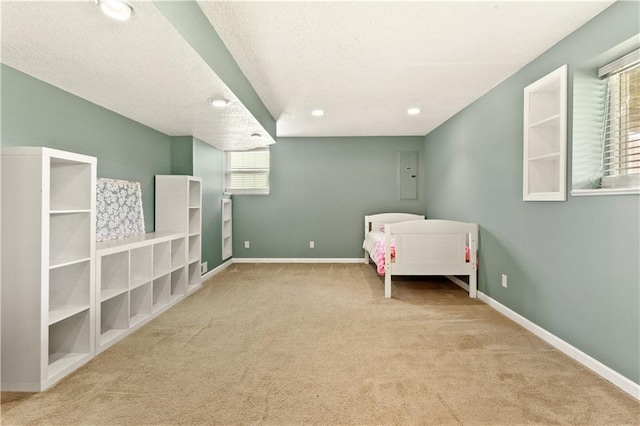 2105 NW Sweetgum Ct, Grain Valley, MO 64029 - unfurnished bedroom with carpet floors, a textured ceiling, and recessed lighting