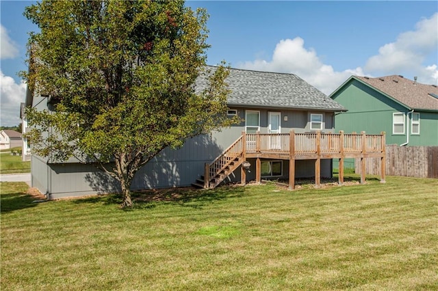 2105 NW Sweetgum Ct, Grain Valley, MO 64029 - back of property featuring a wooden deck, stairs, and a shingled roof