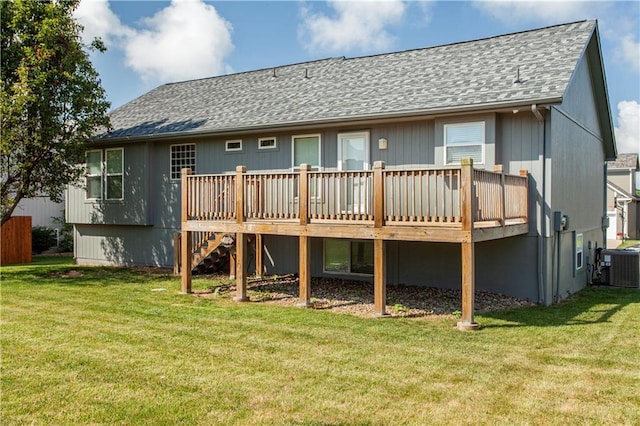 2105 NW Sweetgum Ct, Grain Valley, MO 64029 - back of property with roof with shingles, a wooden deck, and a yard
