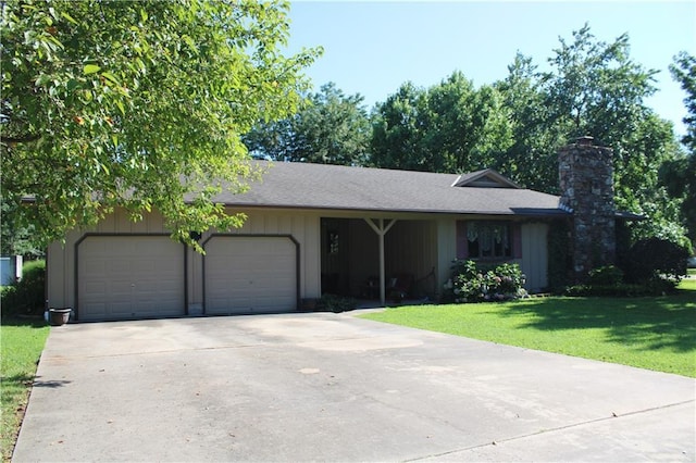 612 N 4th St, Arma, KS 66712 - ranch-style home with a garage, a chimney, a front yard, driveway, and a shingled roof