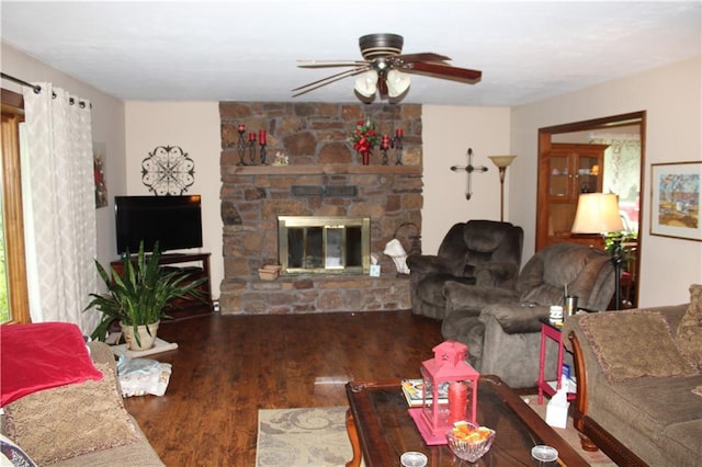 612 N 4th St, Arma, KS 66712 - living room featuring ceiling fan, wood finished floors, and a fireplace