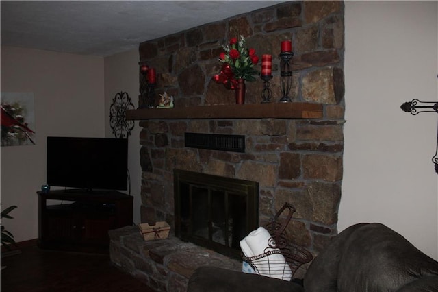 612 N 4th St, Arma, KS 66712 - living room featuring a fireplace and wood finished floors