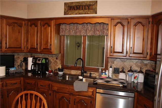 612 N 4th St, Arma, KS 66712 - kitchen featuring dishwasher, dark countertops, and tasteful backsplash