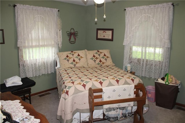 612 N 4th St, Arma, KS 66712 - bedroom with carpet floors and multiple windows