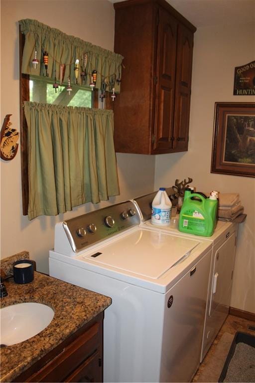 612 N 4th St, Arma, KS 66712 - laundry area with washing machine and clothes dryer and cabinet space
