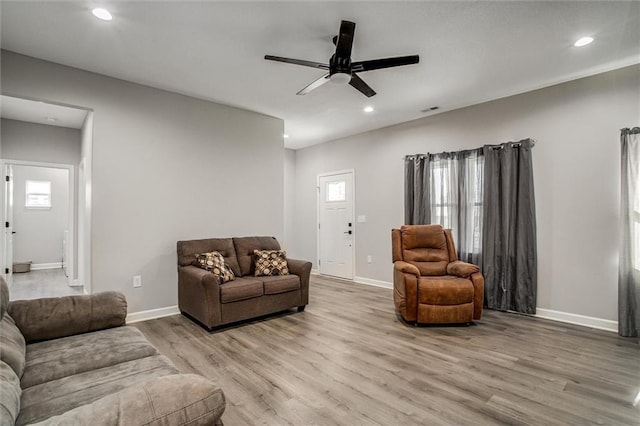 311 S 3rd St, Odessa, MO 64076 - living area with light wood-style floors, ceiling fan, and recessed lighting