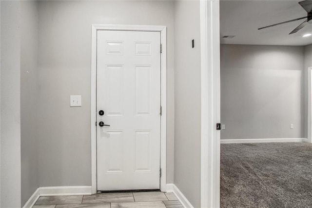 311 S 3rd St, Odessa, MO 64076 - doorway with ceiling fan and baseboards