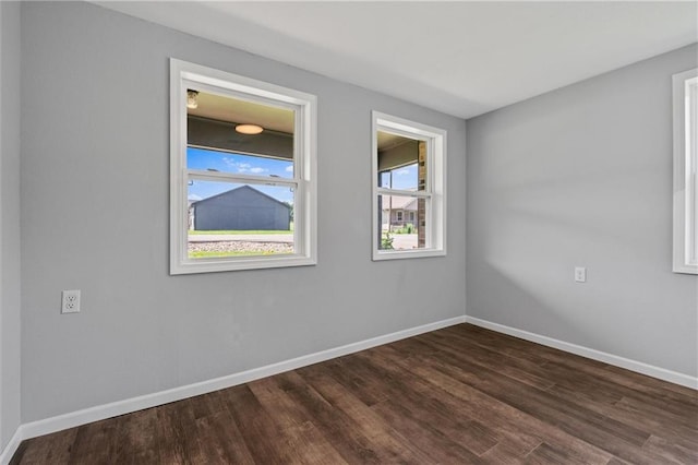 812 W Royle St, Richmond, MO 64085 - unfurnished room with dark wood-type flooring and baseboards